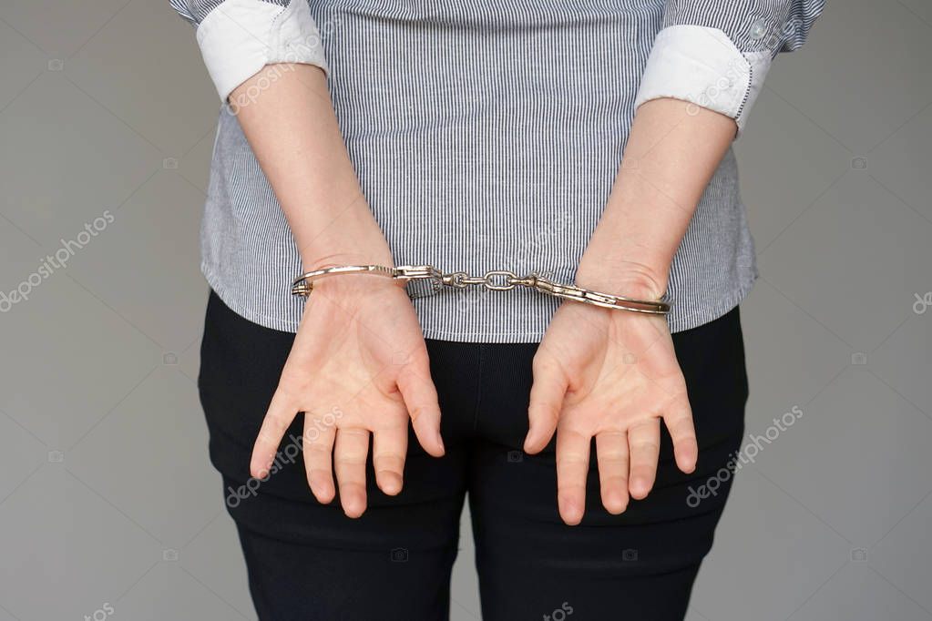 depositphotos200390078-stock-photo-close-arrested-woman-handcuffed-hands-115046